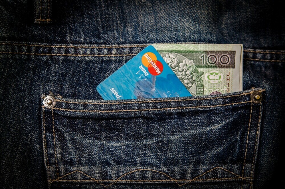 credit card and money in pocket